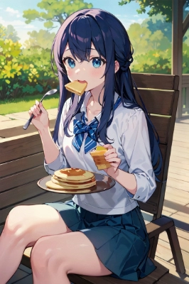 パンケーキをほおばる女子