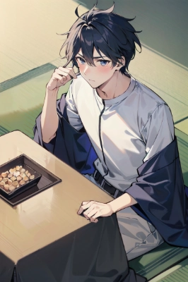 こたつに入る男性